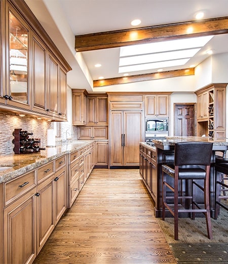 a modern kitchen space with a classic wooden finish